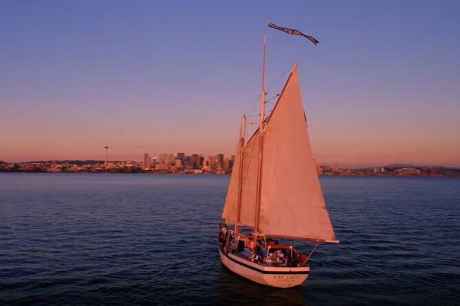 Evening Colors Sunset Sail Tour in Seattle - Drinks, sunset light, and the possible cannon salute